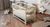 Кроватка детская ДУБОК "Радуга" шарнир-пидшибник с откидной боковиной, дерево бук (Слоновая кicтка) DU-8 фото